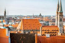 Top cityscape view from the castle hill on the old town with cathedral in Nurnberg during the morning, Germany